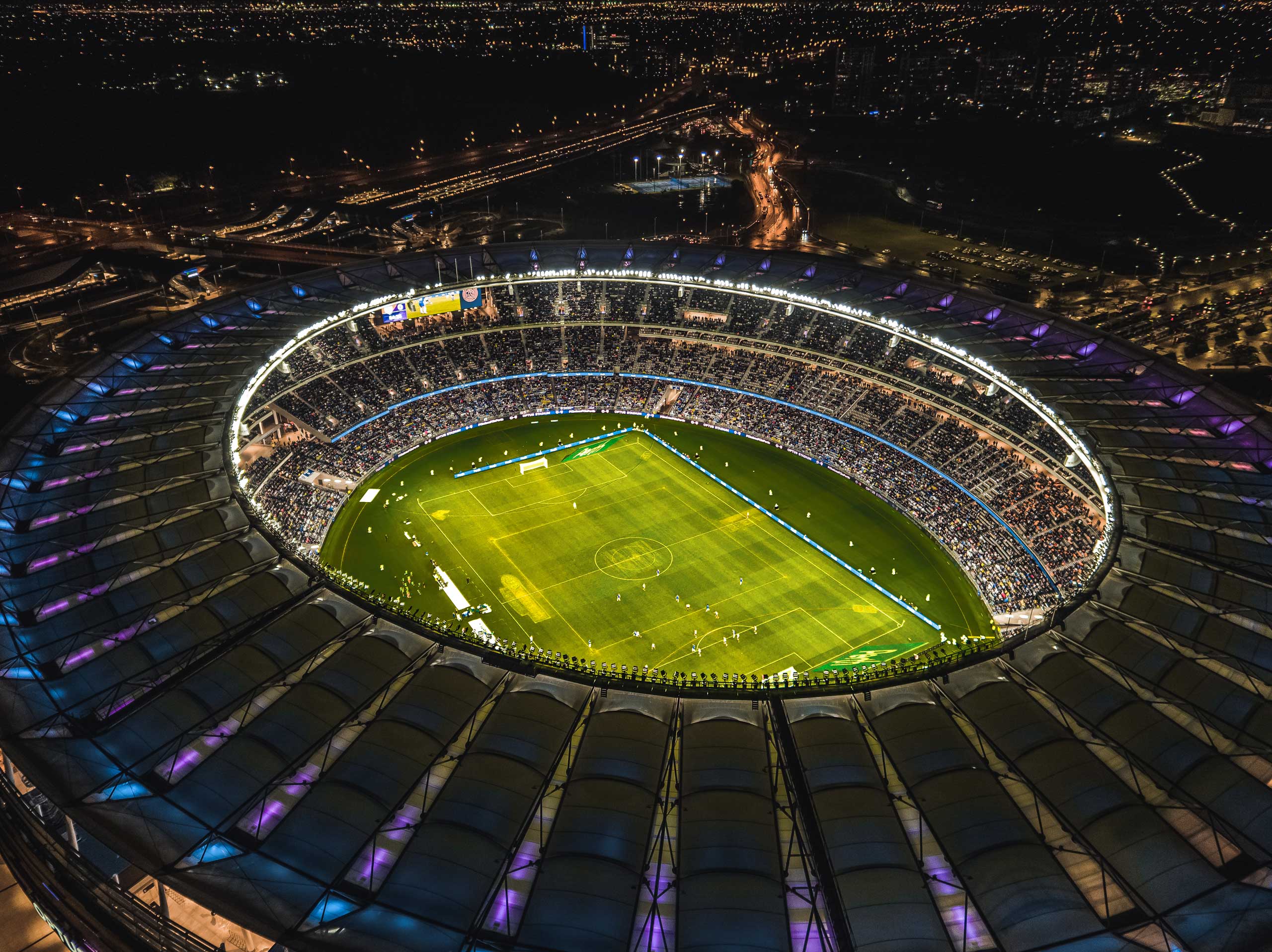 aerial view of optus stadium at night during a soccer game